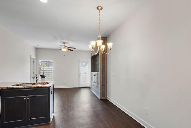 1710 Lone Jack Ln, Murfreesboro, TN 37129 - kitchen with a sink, dark wood-type flooring, baseboards, decorative light fixtures, and dark cabinetry