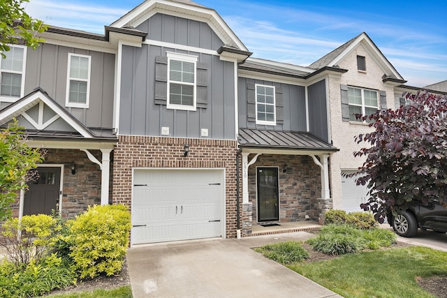 1710 Lone Jack Ln, Murfreesboro, TN 37129 - view of property featuring board and batten siding, a garage, stone siding, driveway, and a standing seam roof