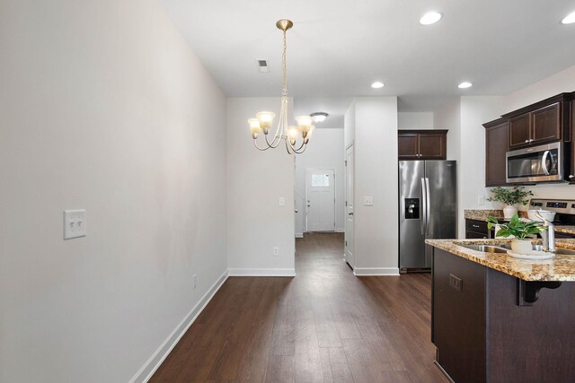1710 Lone Jack Ln, Murfreesboro, TN 37129 - kitchen featuring stainless steel appliances, dark wood-type flooring, dark brown cabinetry, a chandelier, and a breakfast bar area