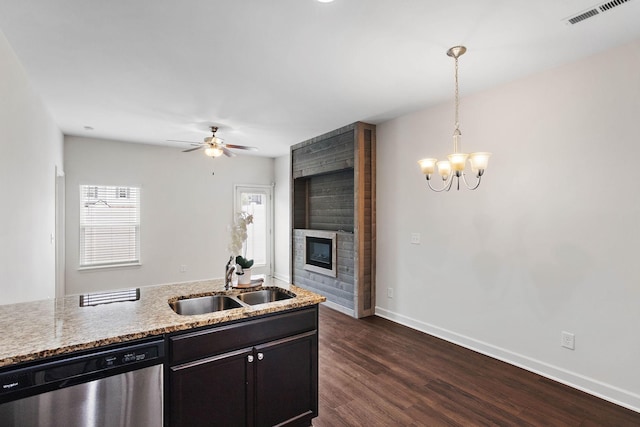 1710 Lone Jack Ln, Murfreesboro, TN 37129 - kitchen featuring dishwasher, a sink, a fireplace, light stone counters, and hanging light fixtures