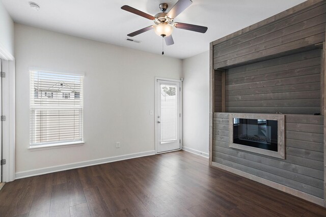 1710 Lone Jack Ln, Murfreesboro, TN 37129 - unfurnished living room featuring wood finished floors, a glass covered fireplace, baseboards, and ceiling fan