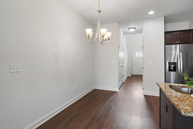 1710 Lone Jack Ln, Murfreesboro, TN 37129 - kitchen featuring stainless steel fridge, dark wood-type flooring, a chandelier, baseboards, and light stone countertops