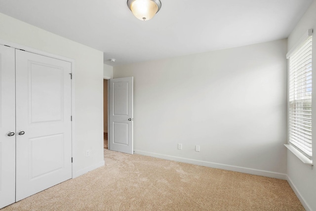 1710 Lone Jack Ln, Murfreesboro, TN 37129 - unfurnished bedroom with light carpet, baseboards, and a closet