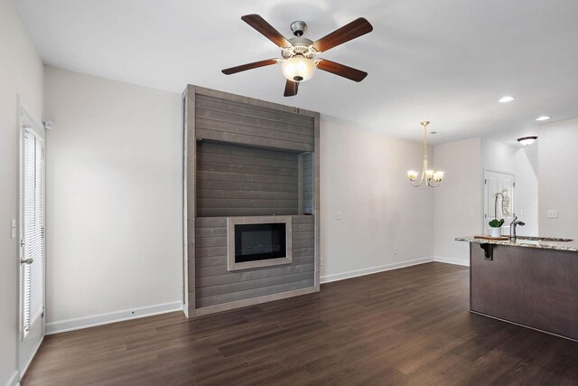 1710 Lone Jack Ln, Murfreesboro, TN 37129 - unfurnished living room featuring a fireplace, recessed lighting, dark wood-style floors, a ceiling fan, and a chandelier