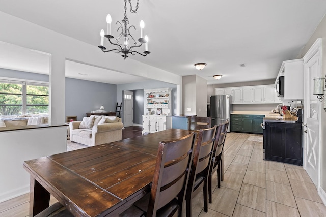 51 N Case Ave, Trenton, GA 30752 - dining space with a chandelier and baseboards