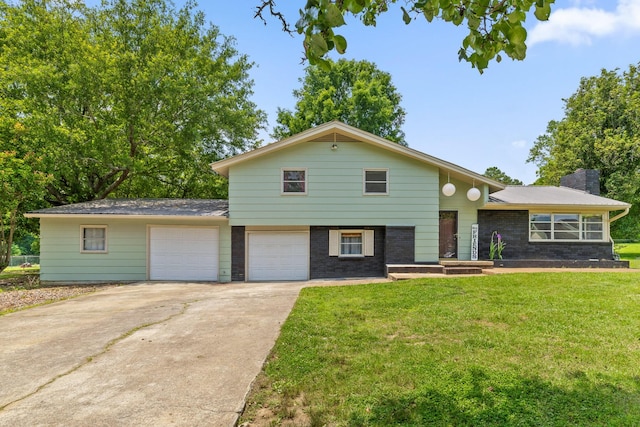 51 N Case Ave, Trenton, GA 30752 - tri-level home with a front yard, driveway, a chimney, brick siding, and a garage