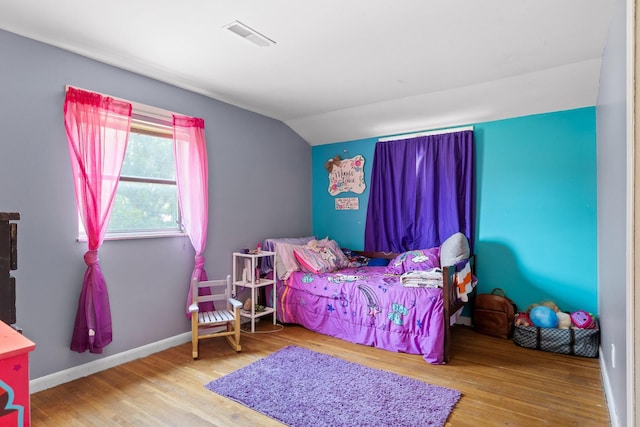 51 N Case Ave, Trenton, GA 30752 - bedroom with vaulted ceiling, wood finished floors, and baseboards