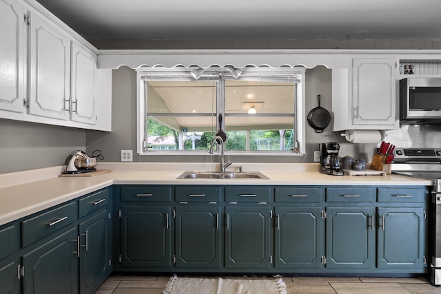 51 N Case Ave, Trenton, GA 30752 - kitchen featuring a sink, stainless steel appliances, white cabinetry, and plenty of natural light