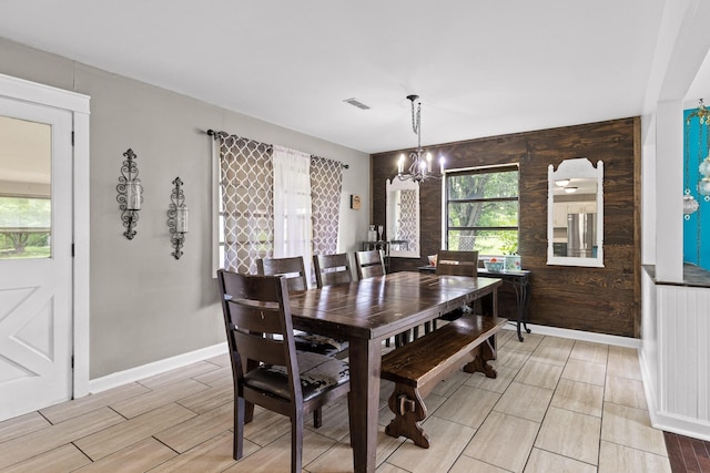 51 N Case Ave, Trenton, GA 30752 - dining area featuring a chandelier, wood tiled floors, and baseboards