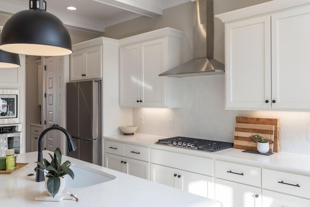 140 Barlow Dr, Franklin, TN 37064 - kitchen with wall chimney range hood, stainless steel appliances, backsplash, white cabinets, and a sink