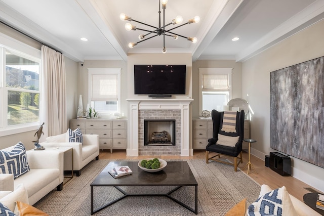 140 Barlow Dr, Franklin, TN 37064 - living area featuring ornamental molding, a chandelier, wood finished floors, a fireplace, and baseboards