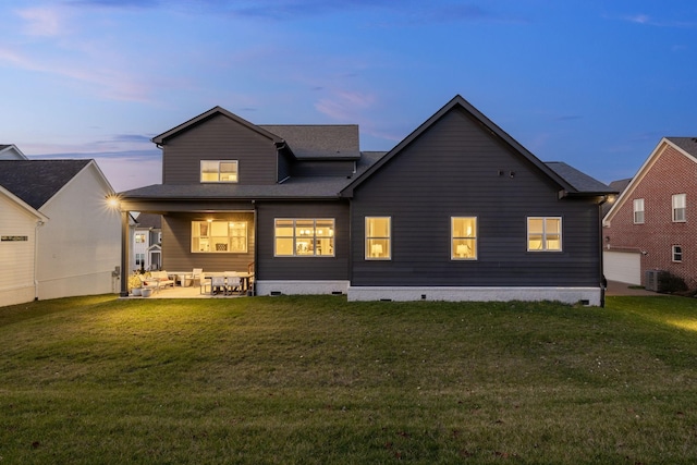 140 Barlow Dr, Franklin, TN 37064 - back of property at dusk with crawl space, a yard, a patio area, and an outdoor hangout area