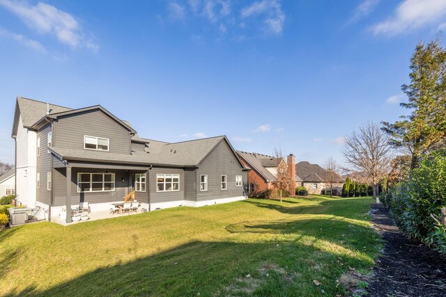 140 Barlow Dr, Franklin, TN 37064 - rear view of house featuring a lawn, a patio area, and central AC