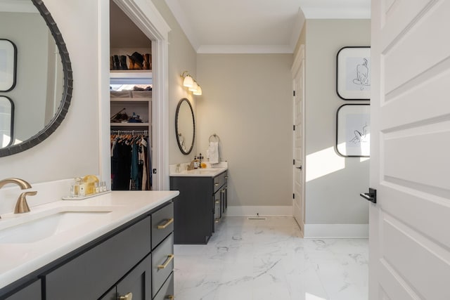 140 Barlow Dr, Franklin, TN 37064 - bathroom featuring two vanities, a spacious closet, marble finish floors, crown molding, and baseboards