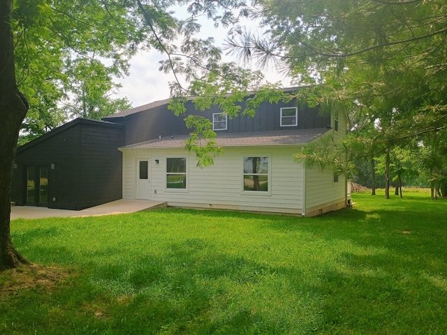 657 Chaffin Rd, Lafayette, TN 37083 - back of property with a yard, a patio, and board and batten siding