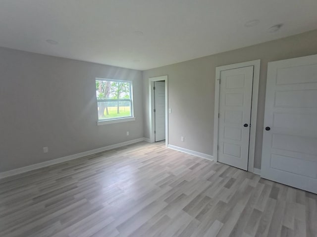 657 Chaffin Rd, Lafayette, TN 37083 - unfurnished bedroom with light wood-type flooring and baseboards