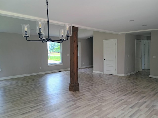 657 Chaffin Rd, Lafayette, TN 37083 - spare room with a chandelier, light wood-style floors, and baseboards