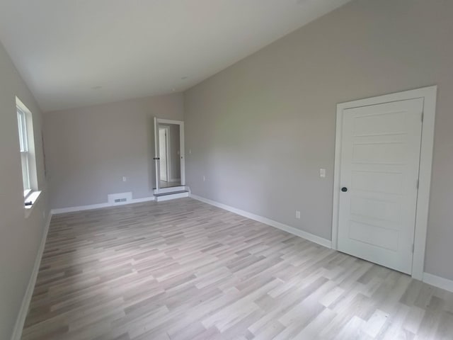 657 Chaffin Rd, Lafayette, TN 37083 - spare room with vaulted ceiling, light wood-type flooring, and baseboards
