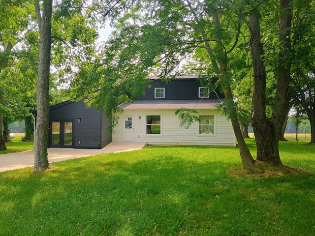 657 Chaffin Rd, Lafayette, TN 37083 - back of house featuring a lawn and french doors