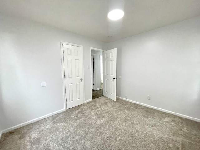 1804 Mchenry Dr, Hopkinsville, KY 42240 - unfurnished bedroom featuring baseboards and carpet floors