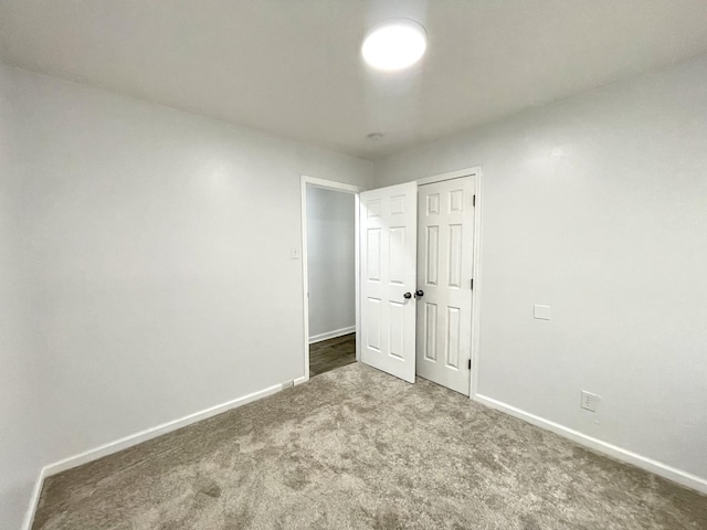 1804 Mchenry Dr, Hopkinsville, KY 42240 - unfurnished bedroom with carpet flooring, baseboards, and a closet
