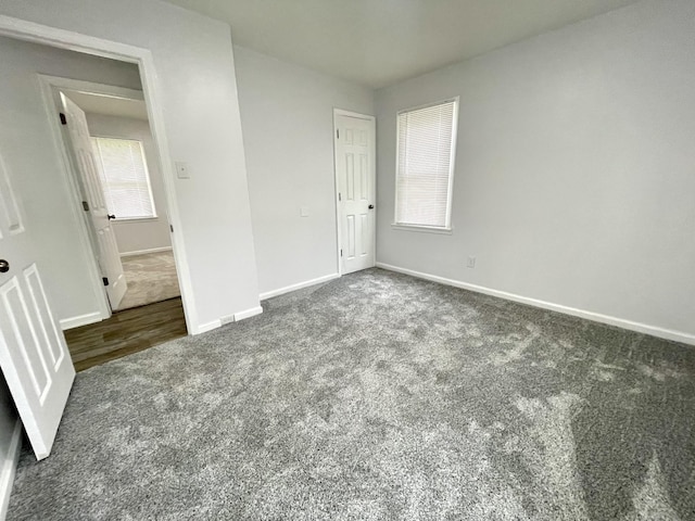 1804 Mchenry Dr, Hopkinsville, KY 42240 - unfurnished bedroom featuring carpet and baseboards