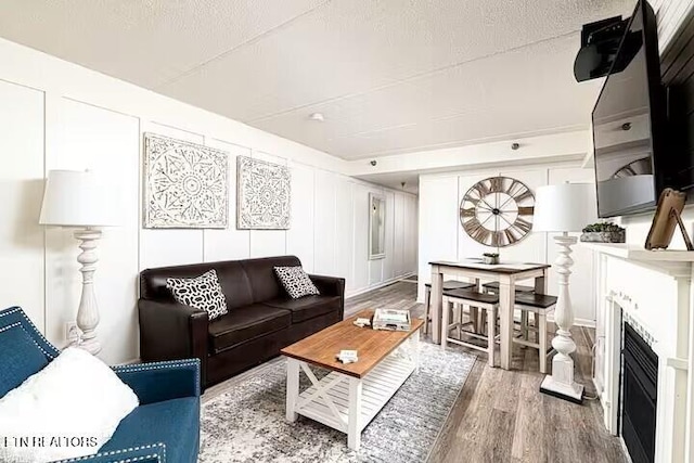 413 Baskins Creek Rd Apt 605, Gatlinburg, TN 37738 - living area with wood finished floors and a fireplace
