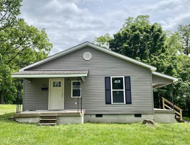 711 Gwen St, Paris, TN 38242 - view of front of property with a front yard, crawl space, and covered porch