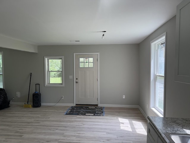 711 Gwen St, Paris, TN 38242 - foyer entrance with light wood finished floors and baseboards