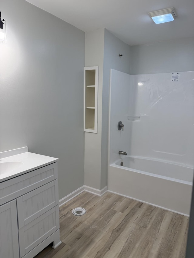 711 Gwen St, Paris, TN 38242 - full bathroom featuring wood finished floors, bathtub / shower combination, and vanity