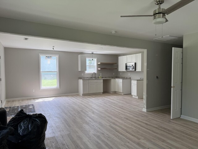 711 Gwen St, Paris, TN 38242 - living room with light wood-style floors and a ceiling fan