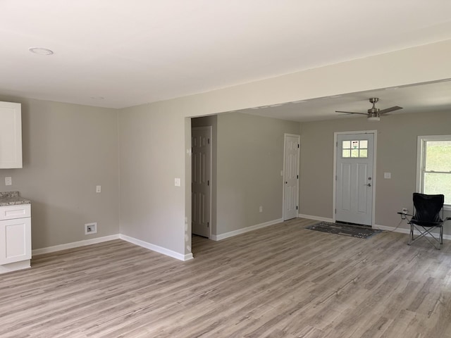 711 Gwen St, Paris, TN 38242 - unfurnished living room featuring light wood-style floors and ceiling fan