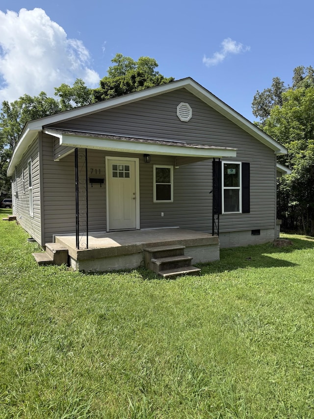 711 Gwen St, Paris, TN 38242 - back of property featuring a porch, a lawn, and crawl space