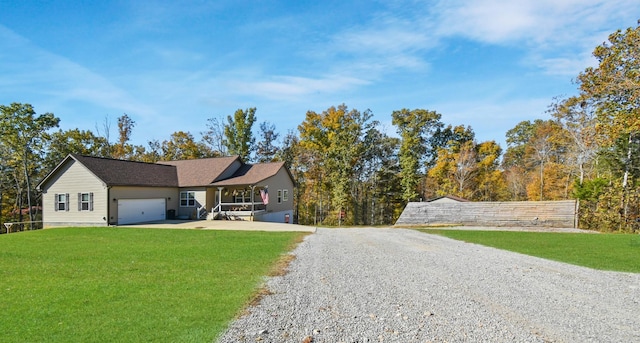 4510 Akin Rd, Cunningham, TN 37052 - single story home featuring gravel driveway, a garage, and a front lawn