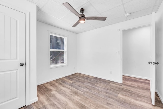 4510 Akin Rd, Cunningham, TN 37052 - unfurnished bedroom with a drop ceiling, wood finished floors, and a ceiling fan