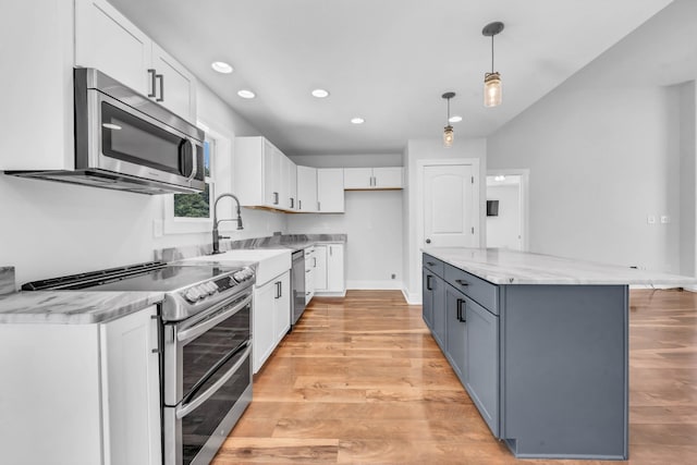 4510 Akin Rd, Cunningham, TN 37052 - kitchen featuring stainless steel appliances, white cabinets, recessed lighting, hanging light fixtures, and a center island