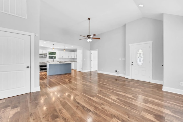 4510 Akin Rd, Cunningham, TN 37052 - unfurnished living room with ceiling fan, wood-type flooring, high vaulted ceiling, and recessed lighting