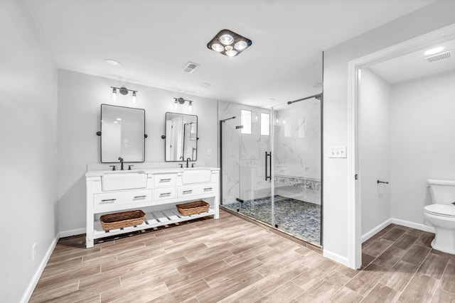 4510 Akin Rd, Cunningham, TN 37052 - full bathroom featuring double vanity, a marble finish shower, wood finished floors, and recessed lighting