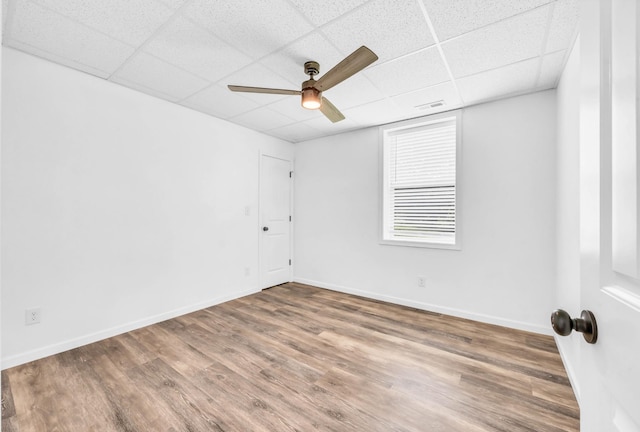 4510 Akin Rd, Cunningham, TN 37052 - empty room with a drop ceiling, wood finished floors, and ceiling fan