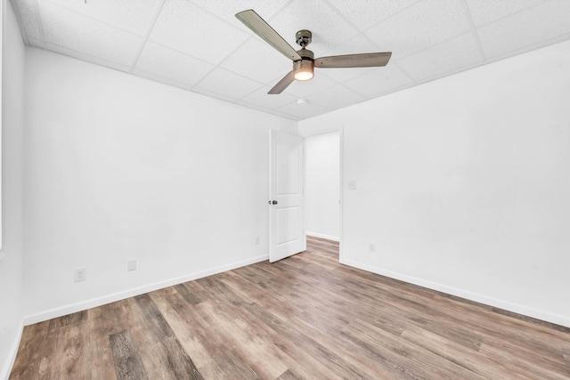 4510 Akin Rd, Cunningham, TN 37052 - unfurnished room with a paneled ceiling, wood finished floors, and ceiling fan