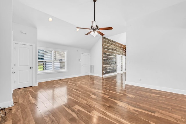 4510 Akin Rd, Cunningham, TN 37052 - unfurnished living room with wood finished floors, ceiling fan, lofted ceiling, and built in shelves