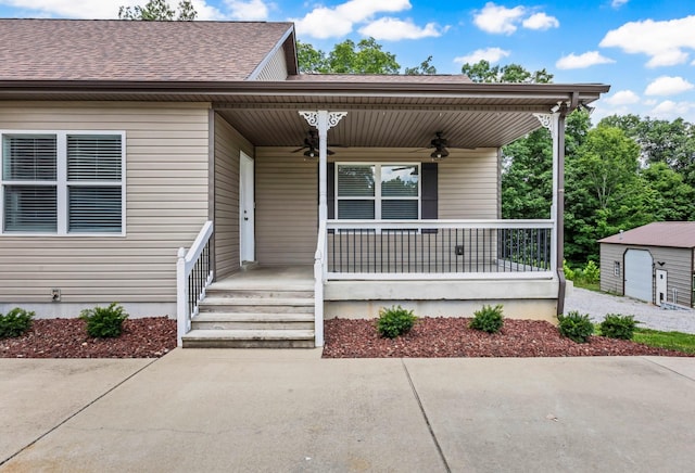 4510 Akin Rd, Cunningham, TN 37052 - view of front facade with ceiling fan, a porch, roof with shingles, and an outdoor structure