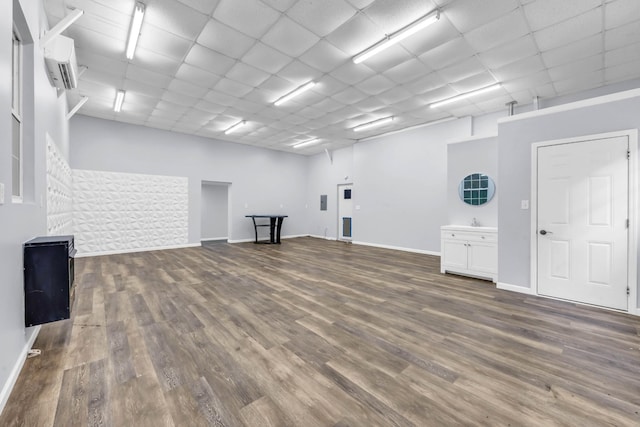 4510 Akin Rd, Cunningham, TN 37052 - misc room featuring a wall unit AC, wood finished floors, and a paneled ceiling