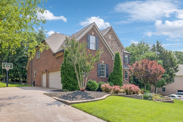 2064 Catalina Way, Nolensville, TN 37135 - view of front facade featuring driveway, a front lawn, brick siding, and an attached garage