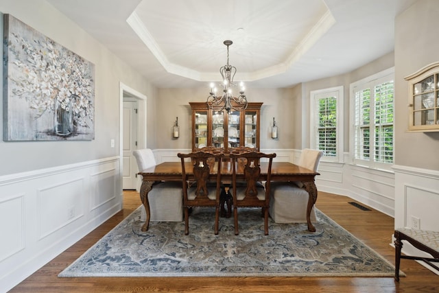 2064 Catalina Way, Nolensville, TN 37135 - dining area with a chandelier, a raised ceiling, crown molding, dark wood finished floors, and a wainscoted wall