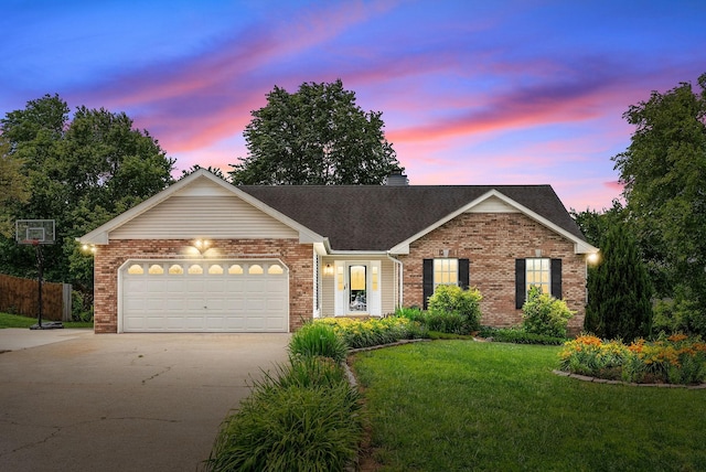 3400 N Henderson Way, Clarksville, TN 37042 - view of front of home featuring brick siding, concrete driveway, a front lawn, an attached garage, and roof with shingles