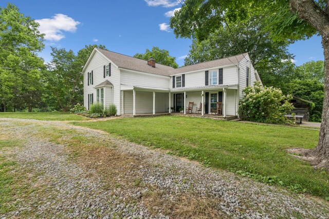 266 Guill Rd, Mount Juliet, TN 37122 - view of front facade with a chimney, a front lawn, and a porch