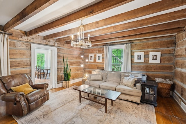 266 Guill Rd, Mount Juliet, TN 37122 - living room with healthy amount of natural light, wooden walls, hardwood / wood-style floors, a chandelier, and beamed ceiling