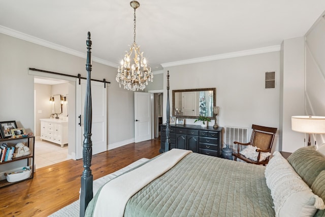 266 Guill Rd, Mount Juliet, TN 37122 - bedroom with a barn door, ornamental molding, wood finished floors, a chandelier, and baseboards