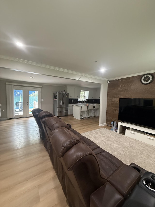 561 Castlegate Dr, Nashville, TN 37217 - living room with light wood finished floors, french doors, and ornamental molding
